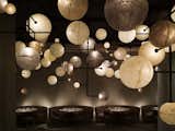 Public, Chicago 

Ian Schrager’s Public Chicago, designed by Yabu Pushelburg, achieves its aim of being both sophisticated and affordable. A muted color palette allows accents to emerge. The array of planetary lights in the hotel’s bar, Pump Room, is a prime example.