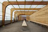 By creating an outdoor pavilion for swimmers to change, the designers relieved an interior gym space that was dedicated to swimming in summer months. Photo by Michael Moran.  Photo 1 of 5 in Parsons Students Transform an Aging Rec Center