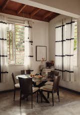 IKEA is an excellent option for stylish, inexpensive curtains, like these sheer, pinch pleat linen-like drapes.