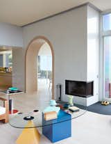 Living Room, Coffee Tables, Light Hardwood Floor, Ceramic Tile Floor, and Corner Fireplace Adrian designed the Basic coffee table.

  Photo 20 of 25 in A Vibrant, Iconic Home Hits the Market in Hawaii For $9.8M from Thank Sottsass for the Most Memphis House Imaginable