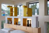 Renzo Brugola, a Memphis designer and cabinetmaker, built the custom bed and headboard in the master bedroom. Sottsass designed both, as well as the yellow storage units, adding a door and lock to one of them "for the purpose of putting in our love letters," notes Adrian.

