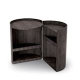 Moon table by Mist-o for Living Divani

The compact charcoal-dyed cylindrical oak bedside table opens to reveal interior storage shelves.