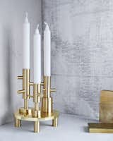 No electricity is needed when using Jaime Hayon's brass candlesticks, which are part of Fritz Hansen's new accessories line.