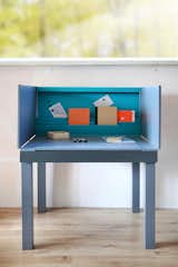 Her Multifunctional Desk features a stowable back and drop-down sides. It can transform from a desk to a dining table.