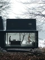 In 2015, Vipp introduced a 592-square-foot prefab unit called Shelter. It's equipped with a freestanding island from the brand's kitchen line.  Photo 13 of 28 in Houses by Alchemias from Turns Out Matte-Black Kitchens Are Fool-Proof