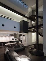 A pivoting Gyrofocus fireplace, staircase, and elevator shaft organize the social space. Lighting throughout the house is mostly ambient, supplemented by task-oriented lighting.