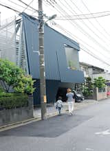 "Everyone stops to look at the building," says Motoshi. Neighbors may stare at the severe facade, but once inside they are amazed with the quality and comfort of his home. Its efficient design comes from IDEA Office’s clever rethink of local zoning regulations and required setbacks.