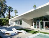 Outdoor, Large Pools, Tubs, Shower, Concrete Patio, Porch, Deck, and Grass Cloe chaise longues from Myyour surround the pool.  Photo 2 of 16 in Outside/yard by Nallely Camacho from An Energy-Efficient Hybrid Prefab Keeps Cool in the Palm Springs Desert
