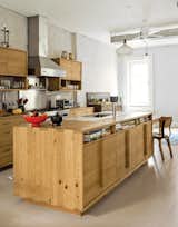 A family enlists Brooklyn design-build firm MADE to renovate a brownstone using surplus and salvaged materials for a budget-conscious patina. In the kitchen, the island and cabinets, fashioned from remilled Douglas-fir beams salvaged from upstate New York, sport inexpensive drawers from Ikea.