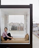 Irish-born actress Cornelia Hayes-O’Herlihy gazes across the Venetian roofscape. Her cozy glass enclosure rests atop the new home designed by her husband, architect Lorcan O’Herlihy.