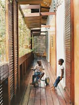 The wraparound balcony is a playground for four-year-old Kwaku; there he plays soccer, chases the family’s four dogs, and hangs out with his friend and neighbor, Anita.