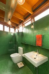 Vibrant green tile adds punch to the bathroom.

For more houses in the region, view "Super Sydney: 5 Modern Houses from Down Under" and "A Hillside Family Home in Australia."  Photo 8 of 8 in Modern Bathroom Design, Remodeling, and Decor Ideas by Megan Hamaker