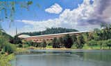 Marin County Civic Center (1957, San Rafael, California). Wright's design for the Marin County Civic Center blends into the surrounding hills, and even bridges over two with a series of arches.