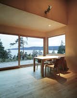 The cabin's living room area opens up to the surroundings. Walls and ceiling are clad in birch veneer while the floor is in solid birch.