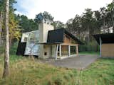 After living on and studying a woodsy acre of land in North Zealand, Denmark, architect Jesper Brask cleared a stand of pine trees and, from the timber, built a getaway open to its surroundings. The house, which Brask shares with his wife, Lene, and sons, Kristian, Jens, and Niels, is used mainly in summer, when the weather is optimal for throwing open the glass doors.