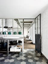 For the floors in the kitchen and throughout, Navone placed hexagonal Carocim tiles of her own design.  Photo 3 of 11 in Paola Navone's Industrial Style Renovation in Italy
