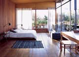 A COZY AND MODERN INDOOR-OUTDOOR BEDROOM IN BUENOS AIRES

In Argentinean architect and furniture designer Alejandro Sticotti's bedroom, dappled sunlight and reclaimed-wood floors and walls give the room a warm, peaceful feel.