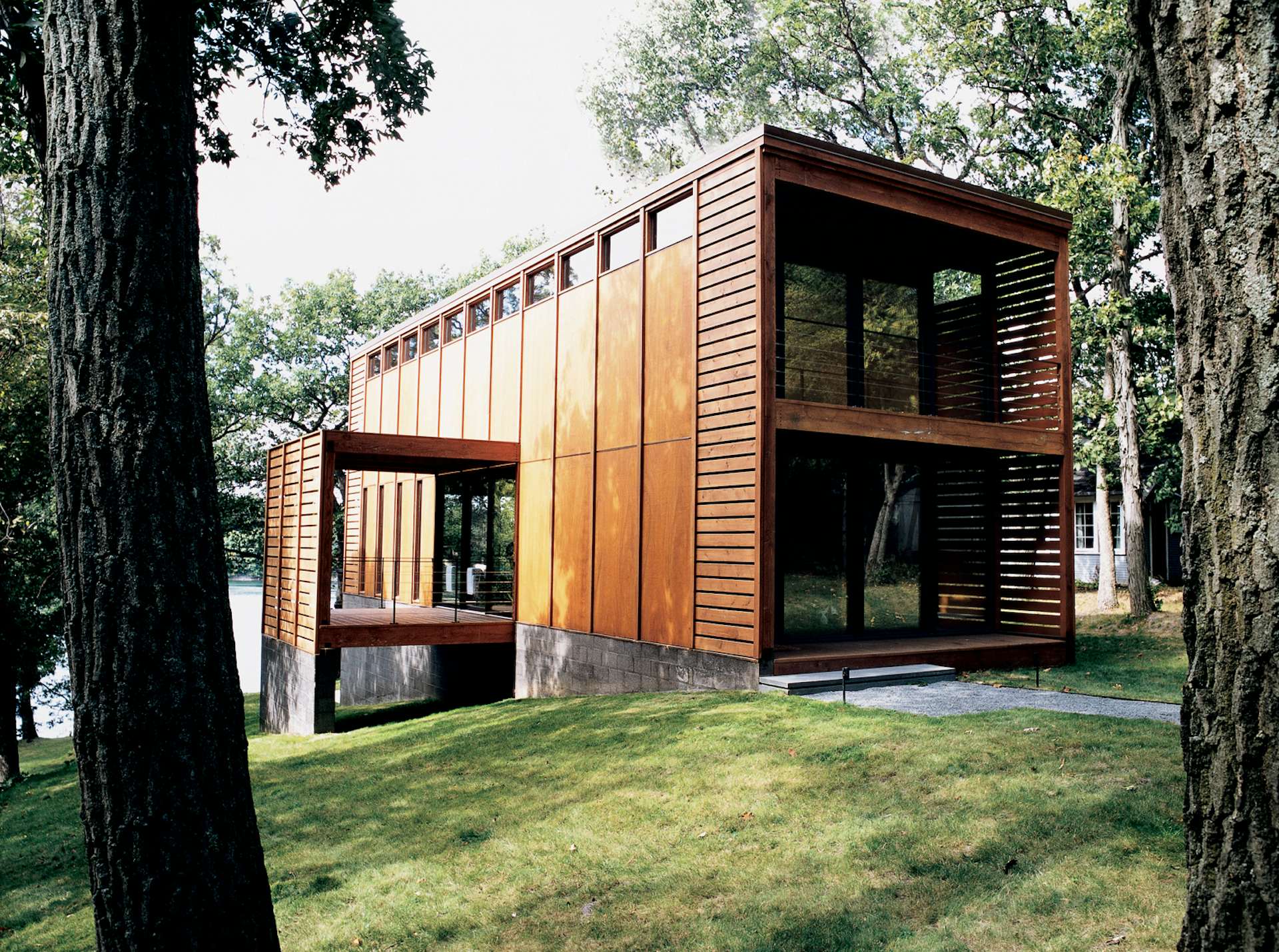 Milwaukee studio Vetter Denk Architects designed this eye-catching prefab on the banks of Moose Lake, Wisconsin, as a weekend retreat. The design was based on an idea presented by the homeowner, who was inspired by a screw-top jug of red wine.