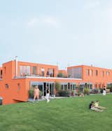 Seen here from the south, Villa van Vijven’s orange facade is meant to mimic the tiled rooftops of Holland’s country buildings, while the building’s horizontal pull echoes the flat landscape.  Search “henny van nistelrooy” from Facades Full of Color