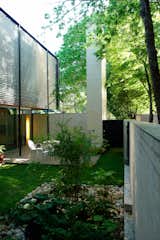 Along the entire west side of the house, a lush courtyard creates private exterior space that can be enjoyed during much of the year in Austin, particularly with large shade trees overhead. The entire ground level of the house opens onto the courtyard, including the first-floor shower.