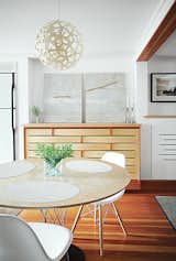 Dining Room, Table, Chair, and Pendant Lighting A Coral pendant lamp by David Trubridge hangs in the dining area.  Search “Small Spaces” from Run-Down Row House in Boston Becomes a Quiet Urban Escape with Two Green Roofs