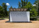 The ReFRAME structure is made up of modular expandable walls repurposed from cubicle frames and covered in clear and white panels with cutouts.  Search “greetings-from-houston-tx.html” from Upcycling Cubicles into Modern Temporary Housing