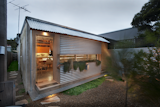 Compact Australian Home Clad in Steel and Concrete - Photo 1 of 10 - 