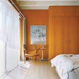 Bedroom, Light Hardwood Floor, Bed, and Chair Sheer curtains let light and breezes into the master bedroom.  Search “mastering wood grain” from Long Island Found