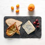 SLATE CHEESE BOARD

This cheeseboard from Brooklyn Slate is a one-of-a-kind serving platter that is locally sourced from co-founder Kristy Hadeka’s family quarry in upstate New York. Each board also includes a piece of soapstone chalk so you can write which kind of cheeses, smoked meats, or other kinds of hors d’oeuvres are being served.