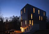 In Pittsboro, North Carolina, design-build firm Tonic contstructed a four-story, 3,200-square-foot residence for a musician and his son. By using, a philosophy of "construction-led design" to inform the structure's details, the firm was able to realize the design for $200 per square foot. Located on a 60-acre plot of land, the house features green elements like a small footprint, bamboo flooring, Energy Star appliances, natural daylighting, an efficient HVAC system, and operable windows for cross ventilation.