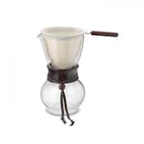 HARIO COFFEE DRIP POT $60.00

The Hario Drip Pot is a manual coffee maker, made for brewing coffee in small servings. Using a reusable cloth filter, the Drip Pot is an ideal vessel when paired with a pour over kettle like the Hario Drip Kettle. The filter rests easily within the top of the pot, which has a narrow, tulip shape to aid in the brewing process. The base of the pot is more bulbous, which enables the coffee to expand and grow its flavor once it works its way through the filter. After the coffee has brewed and the filter is removed—an easy task with the filter’s wood handle— coffee can be poured directly from the pot. The wood collar on the drip pot stays cool to the touch, ensuring painless pours, every time.