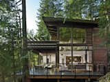 Large Patio, Porch, Deck, Exterior, House Building Type, and Wood Siding Material Photo by Patrick Barta  Photo 1 of 5 in Prefab from Into the Woods