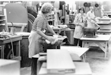 Employees at the Herman Miller factory polish the molded plywood shells in the seventies.