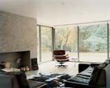 The living room's floor-to-ceiling windows allow plenty of natural light in and offer a clear view of the woods to the rear of the property. Carver is a fan of taxidermy and his stuffed vixen has attracted a number of real-life suitors. The fox (behind the Eames Lounge chair) was previously the mascot of Carver and Carloss's creative agency, Cunning.