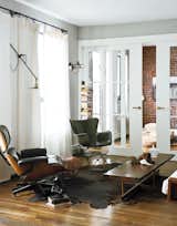 The Eames Lounge sits across a fiberglass chair designed by Richard Conover in this Brooklyn home.