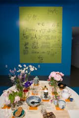 Charles created this rebus for his daughter, Lucia, when she was a child. “Some people want a key for it; some don’t,” says Sussman. Ray’s table was curated by artist Tina Beebe, who worked closely with Ray in the Eames Office and decorated the surface with the flowers and objects Ray favored.