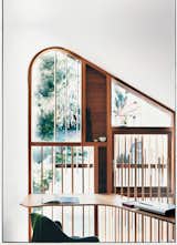 Office and Study Room Type The delicate wooden dowels, used both on the exterior facade and the mezzanine level balustrade, are nods to the bamboo fences traditionally found in tea gardens.  Photo 16 of 21 in Modern by Hannah Eriksen  from Almost Perfect