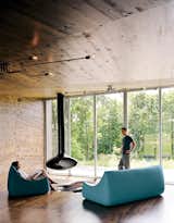 New Grass Roots

With its corrugated-aluminum exterior, X House in Hennepin, Illinois, was built to resemble rural silos. The inside, however, features rich wood paneling and spare furnishings. From floor-to-ceiling windows, the residents have a view of the surrounding grassland.