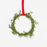 Boxwood Circlet Wreath from Terrain

If modernism is all about simple and functional then this wreath hits the nail on the head. Simple, clean, and festive, while harkening back to the feeling of the evergreen wreaths of yesteryear.
