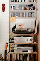 Much of the charm of this small, affordable space is its sense of careful clutter. The stereo, LPs, and CDs only add to the sense that this flat was designed for living, not as some airless showpiece.  Photo 15 of 28 in Urban by Michael Bradley from A Little Apartment Gets a Solid Renovation