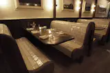 Subway tile-clad booths are the focal point of Goat Town restaurant in Manhattan.