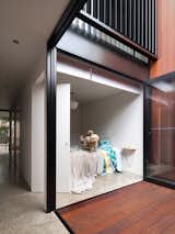 An internal courtyard anchors the house while ushering in air and light. Its materials echo those used in the rear yard. “You get a glimpse of both outdoor spaces when walking through the house,” Abicic says.  Search “Sydney” from Renovated 19th-Century Terrace House Merges with the Outdoors