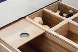 The residents store perishable items that don’t need refrigeration—like fruits, vegetables, onions, and garlic—in maple-lined pantry drawers.