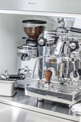 The coffee station features a professional-grade Rocket Espresso machine. Jang and King designed a stainless-steel pullout shelf for a cream and sugar station.