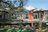 Originally designed by locally renowned architect Arthur Dallas Stenger, this 1960s home featured an unusual awning that was maintained during a 21st-century upgrade by architects Rick and Cindy Black. The architects partially reconfigured the interior layout, updated the kitchen, and added new doors to the porch, all the while making sure the adjustments to the house honored its midcentury provenance while still avoiding creating a time capsule.