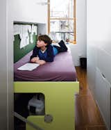 Living small is par for the course in New York City, but accommodating a family of four in under 700 square feet rarely looks as effortless as in this storage-smart renovation. Jonah can easily transform his sleeping berth from desk to bed by himself. Photo by Raimund Koch.