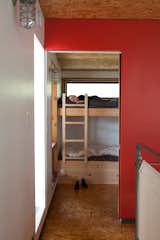 Soren and Annika share a lofted bedroom and a pair of bunks. In Barker and Inzunza's house, this space is used as an office and music room.