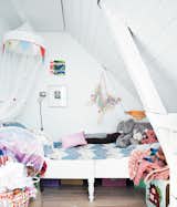 In a former fishermen’s cottage outside Copenhagen, a young family has carved out a cozy, light-filled home. In one corner, the family created a cozy space for their daughter. Photo by Jonas Bjerre-Polsen.