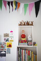 Storage Room and Shelves Storage Type While she was pregnant and on maternity leave, Susanna tackled creative D.I.Y. projects to decorate Varpu's room, including stitching these festive cotton flag banners.  Search “cotton jersey eyemask” from Fine Finnish
