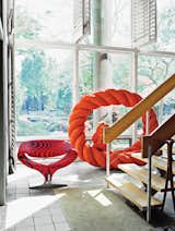The ground floor of the house opens up to a three-story atrium and hosts a few pieces from Larsen’s wide-ranging collections, like a rope sculpture by Mariyo Yagi.